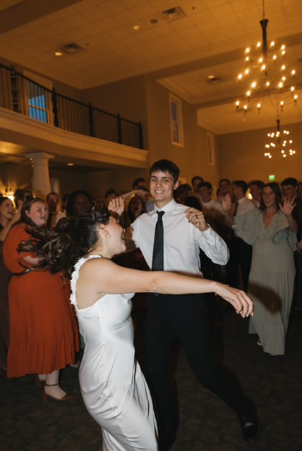 Bride and groom dance together at their wedding